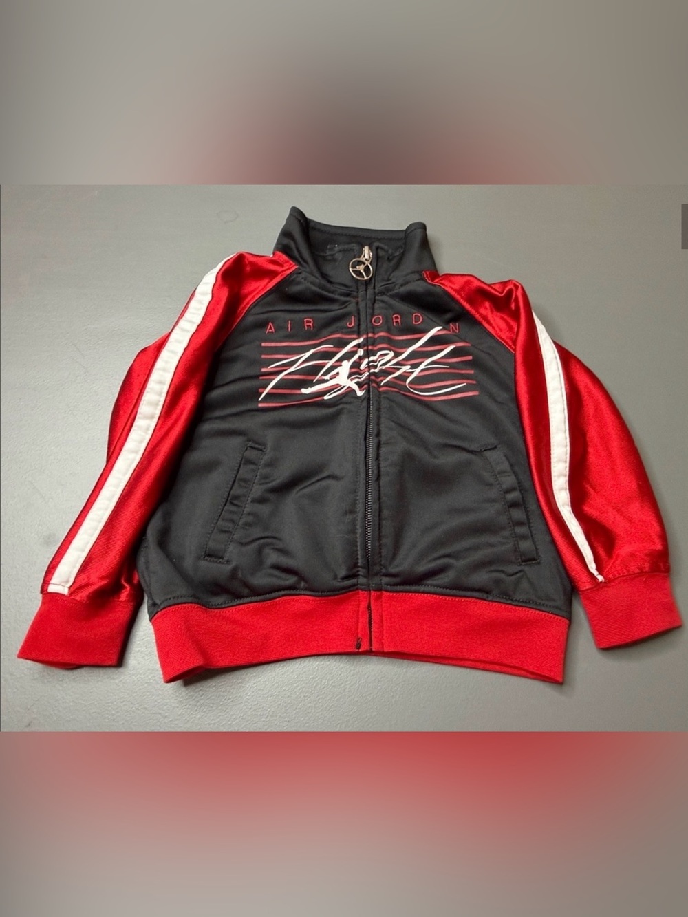 Jordan Black and Red Zip-Front Jacket. Size: 18 Months